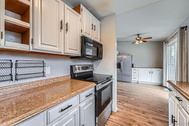 kitchen with ceiling fan, stainless steel appliances, white cabinetry, light wood-type flooring, and open shelves