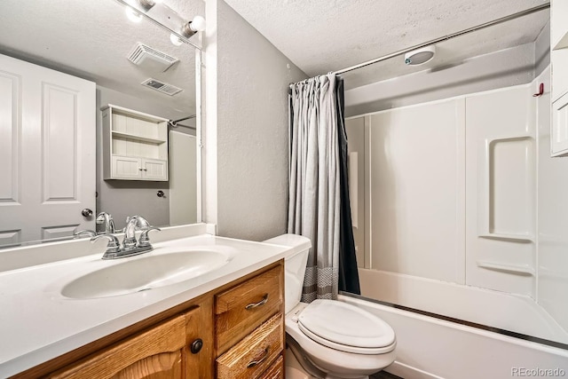 full bathroom featuring toilet, shower / bath combination with curtain, visible vents, and a textured ceiling