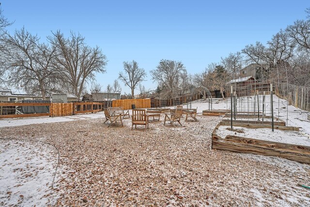 view of yard with a vegetable garden and fence