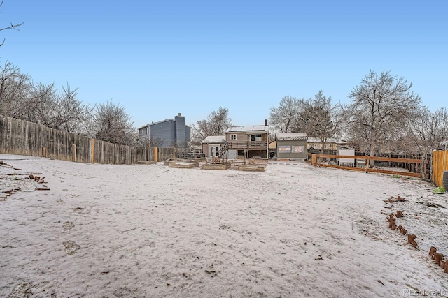 view of yard featuring a fenced backyard, an outdoor structure, and exterior structure