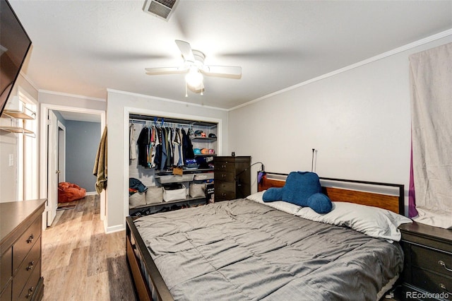 3111 Troy St, Aurora, CO 80011 - bedroom featuring light wood-type flooring, a closet, ornamental molding, ceiling fan, and baseboards