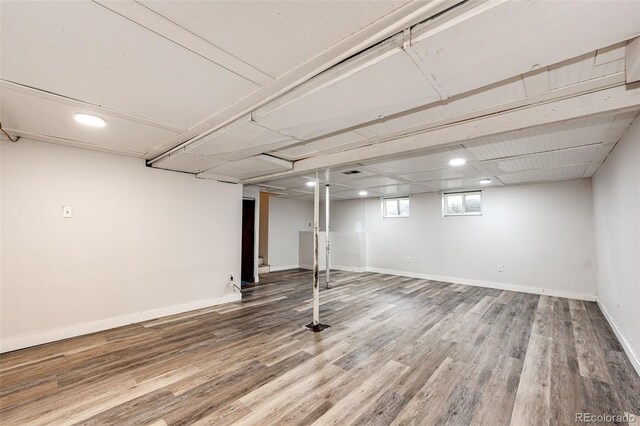 3111 Troy St, Aurora, CO 80011 - basement with wood finished floors, baseboards, and recessed lighting