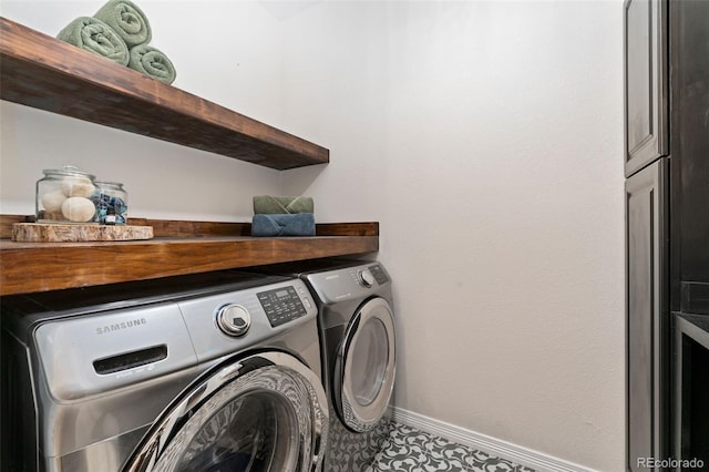 6046 Gilbert Way, Golden, CO 80403 - laundry area featuring washing machine and dryer and baseboards