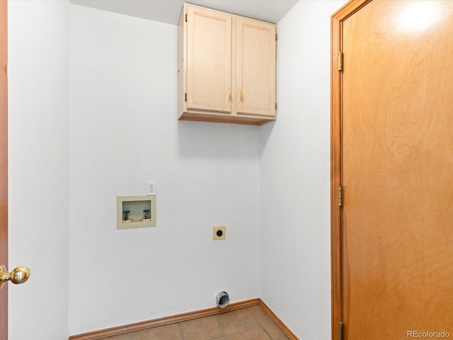 laundry area featuring hookup for a washing machine, cabinets, light tile patterned floors, and electric dryer hookup