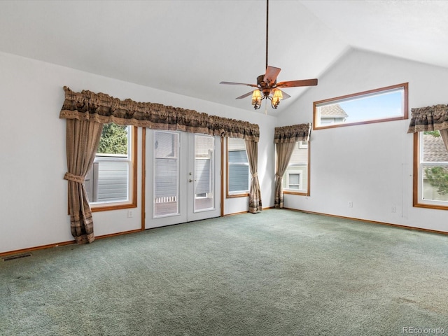 empty room featuring vaulted ceiling, ceiling fan, and carpet flooring