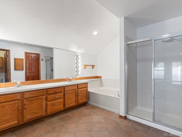 bathroom with vanity, lofted ceiling, and plus walk in shower