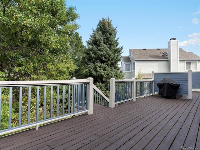 wooden deck featuring grilling area