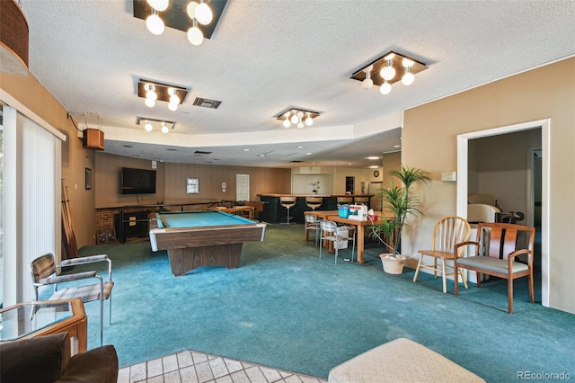 game room with light carpet, a textured ceiling, and billiards