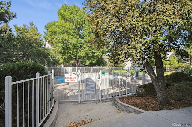 view of gate featuring fence