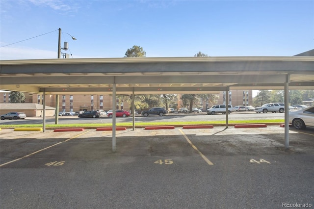 view of parking with a carport