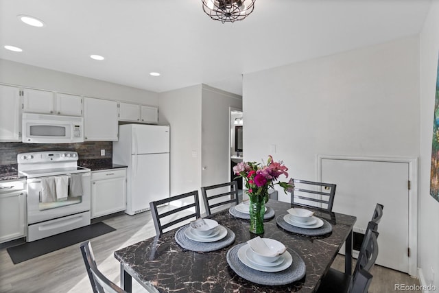 dining room featuring light hardwood / wood-style floors