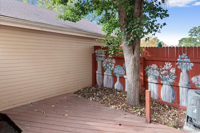 wooden deck with central air condition unit