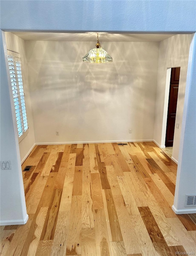 unfurnished dining area featuring light hardwood / wood-style floors