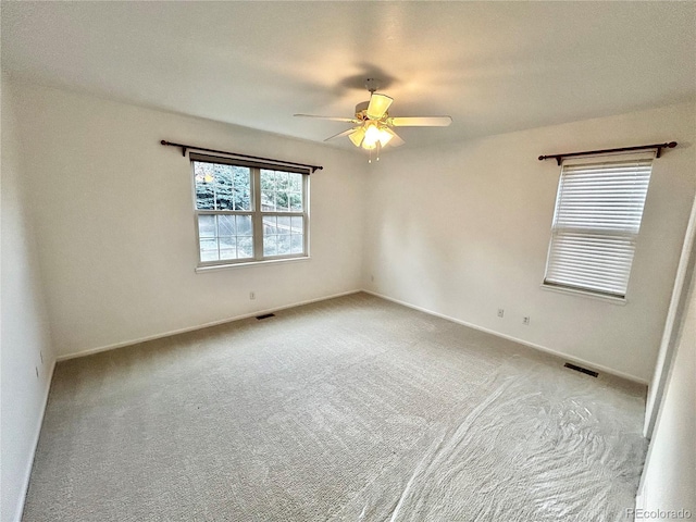 carpeted empty room with ceiling fan