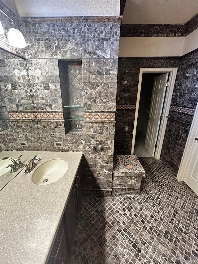 bathroom featuring tile patterned flooring and vanity