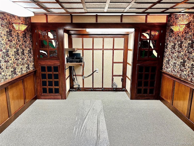 interior space with wooden walls and carpet