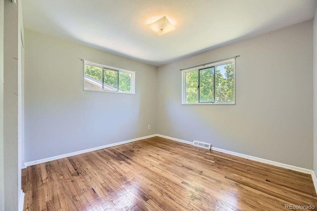 1750 S Dale Ct, Denver, CO 80219 - unfurnished room featuring wood finished floors and baseboards