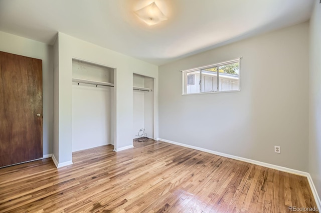 1750 S Dale Ct, Denver, CO 80219 - unfurnished bedroom with hardwood / wood-style floors and baseboards
