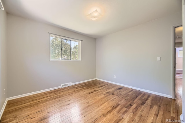 1750 S Dale Ct, Denver, CO 80219 - unfurnished room with baseboards and wood finished floors