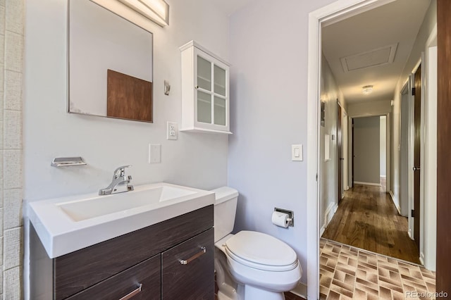 1750 S Dale Ct, Denver, CO 80219 - bathroom featuring toilet and vanity