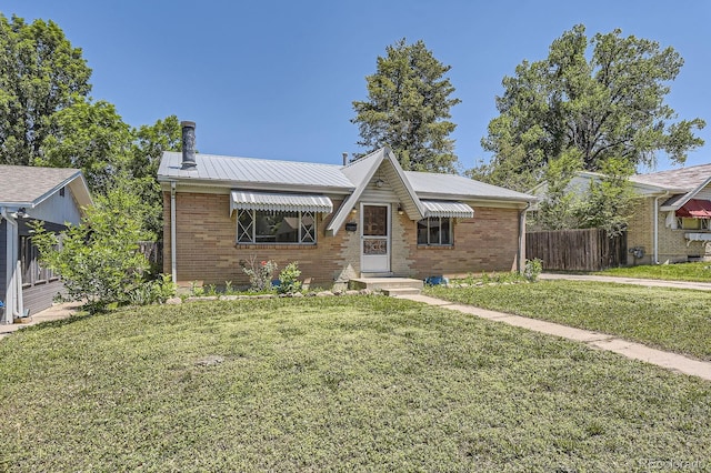 1750 S Dale Ct, Denver, CO 80219 - view of front of property featuring brick siding, a metal roof, and a chimney