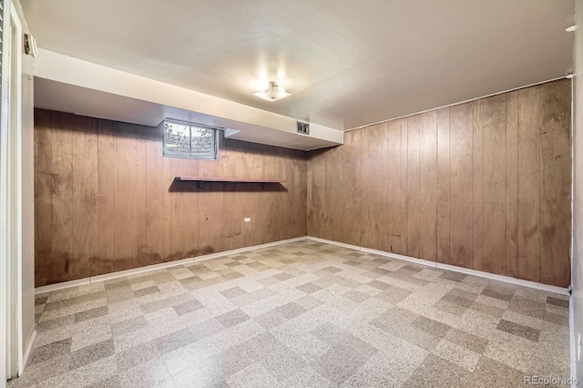 1750 S Dale Ct, Denver, CO 80219 - below grade area featuring wood walls and tile patterned floors