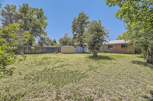 1750 S Dale Ct, Denver, CO 80219 - fenced backyard with a storage unit