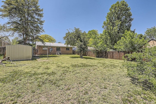 1750 S Dale Ct, Denver, CO 80219 - fenced backyard with a shed
