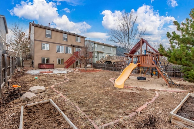 view of playground with a fenced backyard