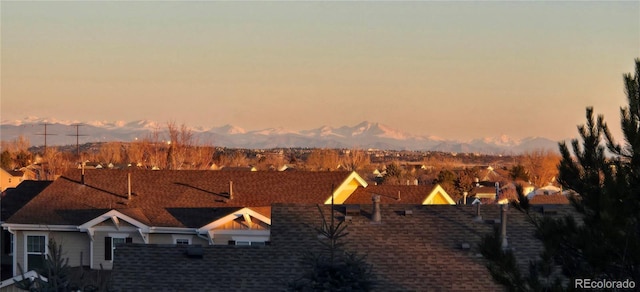 property's view of city with a mountain view