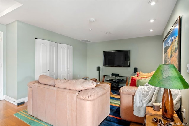 300 W 11th Ave Unit 15F, Denver, CO 80204 - living room with wood finished floors, recessed lighting, and baseboards