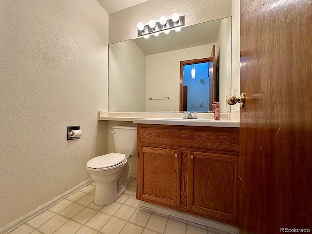 13191 Umatilla St, Denver, CO 80234 - half bathroom with a textured wall, vanity, and tile patterned flooring