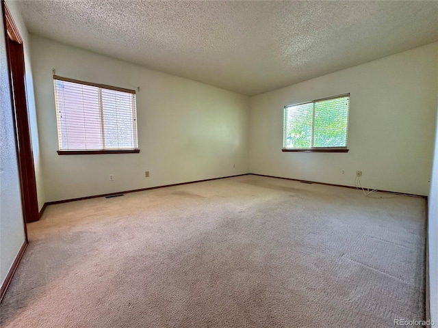 13191 Umatilla St, Denver, CO 80234 - carpeted empty room with a textured ceiling and baseboards