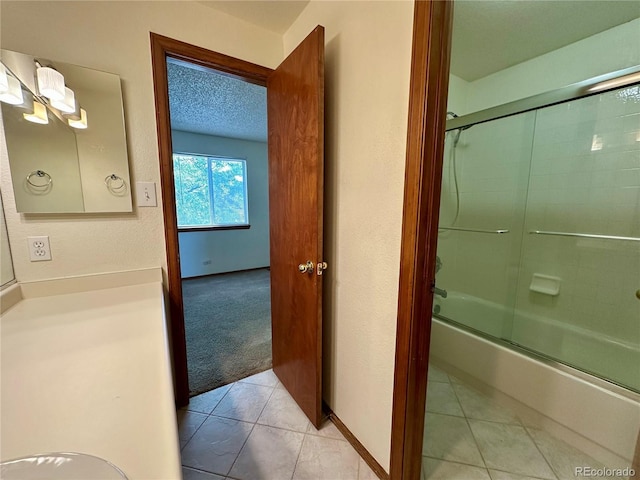 13191 Umatilla St, Denver, CO 80234 - bathroom featuring enclosed tub / shower combo and tile patterned floors