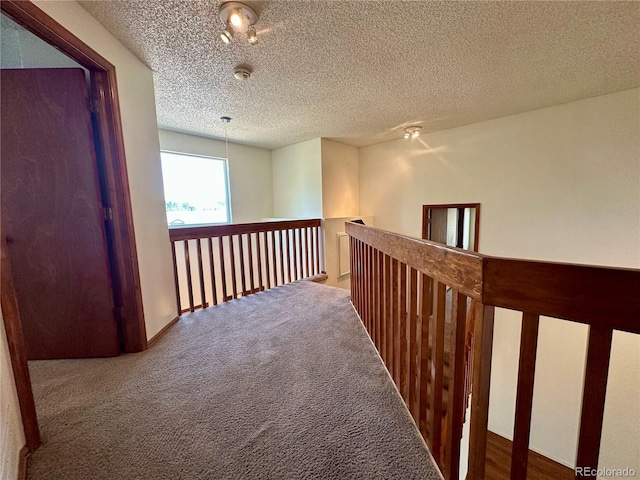 13191 Umatilla St, Denver, CO 80234 - corridor with carpet, a textured ceiling, and an upstairs landing