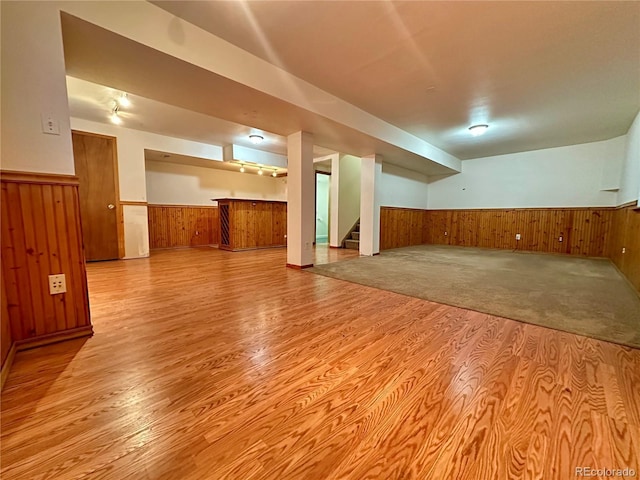 13191 Umatilla St, Denver, CO 80234 - finished basement featuring wainscoting, wood walls, wood finished floors, and stairs