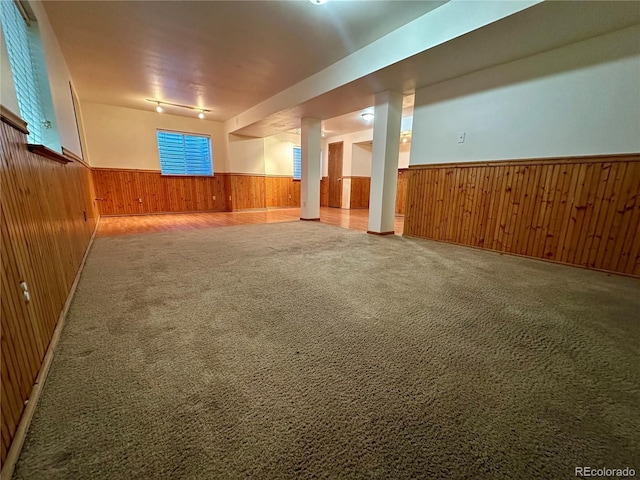13191 Umatilla St, Denver, CO 80234 - spare room featuring a wainscoted wall, wood walls, and carpet floors