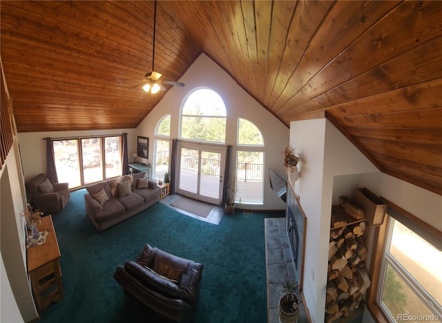 carpeted living room with a ceiling fan, wood ceiling, and high vaulted ceiling