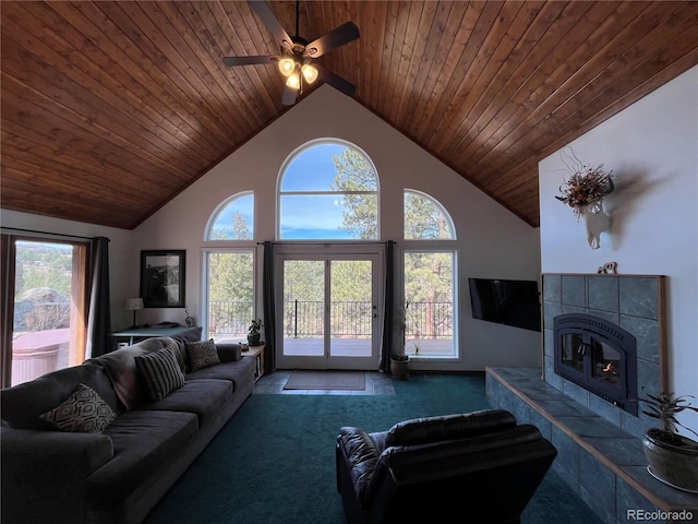 carpeted living room featuring a ceiling fan, wood ceiling, high vaulted ceiling, and a fireplace