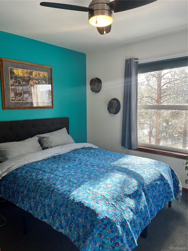 bedroom featuring carpet floors and multiple windows