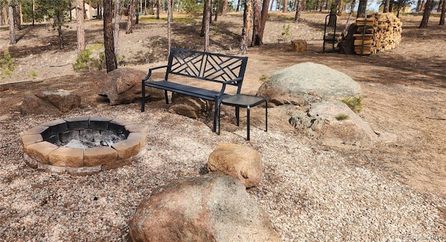 surrounding community featuring a fire pit