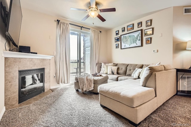 7292 S Blackhawk St Unit 2-204, Englewood, CO 80112 - living room featuring a ceiling fan and a fireplace