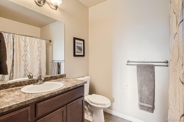 7292 S Blackhawk St Unit 2-204, Englewood, CO 80112 - bathroom with toilet, vanity, and tile patterned flooring