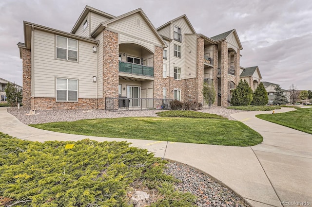 7292 S Blackhawk St Unit 2-204, Englewood, CO 80112 - view of building exterior with fence