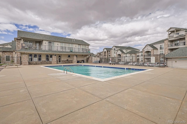 7292 S Blackhawk St Unit 2-204, Englewood, CO 80112 - community pool with fence, a patio, and a residential view