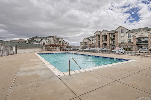 7292 S Blackhawk St Unit 2-204, Englewood, CO 80112 - community pool with fence, a patio area, and a residential view