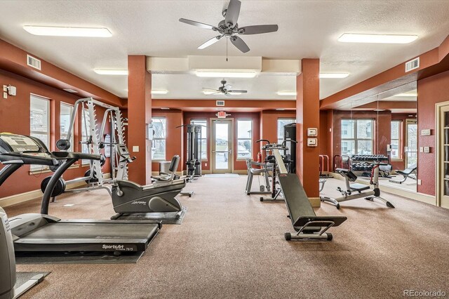 7292 S Blackhawk St Unit 2-204, Englewood, CO 80112 - workout area featuring ceiling fan, a textured ceiling, healthy amount of natural light, and baseboards