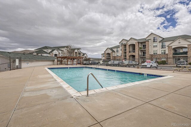 7292 S Blackhawk St Unit 2-204, Englewood, CO 80112 - community pool featuring a patio and a residential view