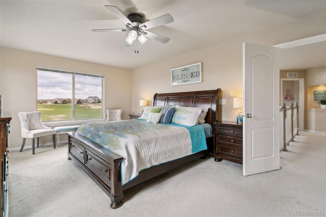 bedroom with light carpet, baseboards, and ceiling fan