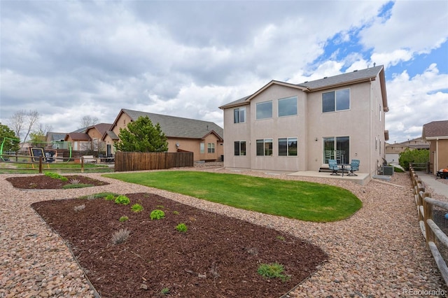 back of property with a patio, stucco siding, and cooling unit